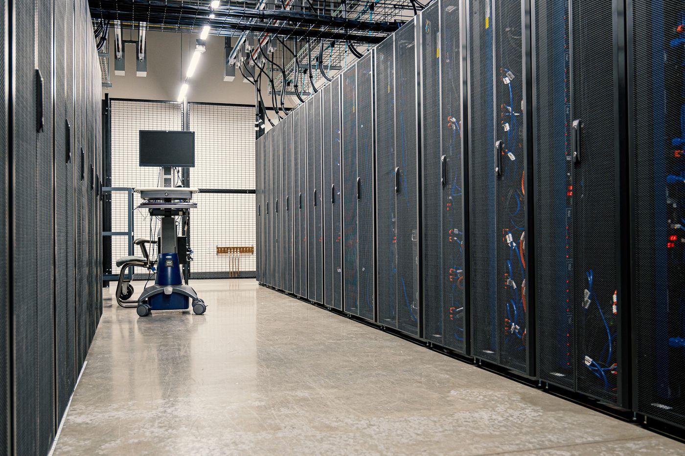 Rows of server racks in a managed data center